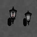 Classic Black Wall Sconces With Illuminated Glass Shades On Gray Wall