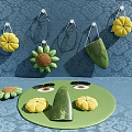Colorful Flower Decorations Hanging On Blue Patterened Wall With Green Plate Items On Table