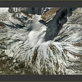 Snow Covered Mountainous Terrain With Glacial Textures And Rocky Peaks