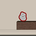 Irregular Shaped Red Frame White Dial Clock On Wooden Shelf Against Beige Wall 3d model