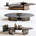 Modern Round Coffee Table With Metal Frame And Decorative Elements Like Tray And Vase