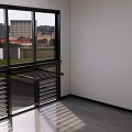 Modern Interior With Large Window City View Gray Flooring And Metal Railing
