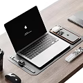 Modern Apple Laptop with iPhone AirPods and Apple Watch in Desk Setup