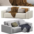 Cream And Light Gray Two Seater Sofa With Colorful Pillows And Soft Blankets