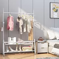 White Clothes Rack With Various Garments In Bedroom And Shoes On Shelf