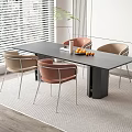Modern Dining Table Set with Black Table Pink Beige Chairs Green Plant and Fruit Bowl