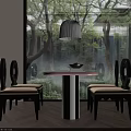 Round Dining Set with Black Chairs Beige Cushions Hanging Lamp by Large Window with Trees Outside