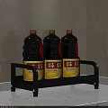 Three Black Condiment Bottles with Yellow Labels on Kitchen Storage Rack 3d model