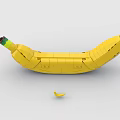 Creative Building Blocks Banana Sculpture With Small Peel Piece On White Background