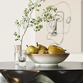 Fresh Ripe Pears In Ceramic Bowl With Green Plant And Glass Cups On Table