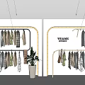 Original Design Hangers with Clothes and Potted Plant in FRAME Store
