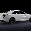 Cadillac White Sedan with Sleek Body Design and Sporty Black Wheels in Studio Lighting Setup