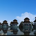 Waterfront Wooden Houses With Reflections In Calm Water And Blue Sky With White Clouds