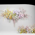 Elegant Floral Display With Wall Mounted And Floor Arrangements Featuring Pastel Yellow Purple Pink Flowers