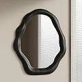 Black Frame Irregular Shape Mirror Mounted On Light Colored Wall With Window Blinds