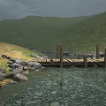Scenic Natural Stream With Rocks Grass And Wooden Bridge Near Rolling Hills