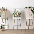 Stylish Display Shelves With Floral Accents And Baby Party Signs On Wooden Easels