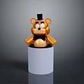Golden Bear Figurine with Black Top Hat and Bow Tie on White Cylindrical Base