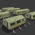 Multiple Green Military Tents In Canvas Material With Ropes And Frames