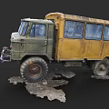 Old Rusty Military Green Truck With Yellow Body And Large Tires On Muddy Ground
