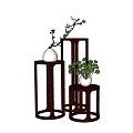 Modern Three Dark Brown Plant Stands With Varying Heights And Green Plants White Vases