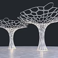 Pair of White Tree Like Columns With Intricate Lattice Design On Checkerboard Floor
