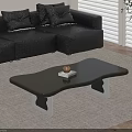 Black Irregular Coffee Table With Transparent Legs And Black Leather Sofa Cushions 3d model