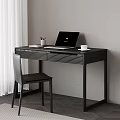 Black Desk Setup With Laptop Cup Pen Holder And Books Near Chair