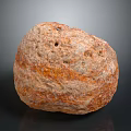 Natural Shaped Brown Orange Stone With Textured Surface And Holes For Decoration