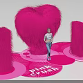 Vibrant Pink Crush Display With Heart Shape I U Plush Decorations And Person