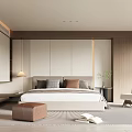 Modern Minimalist Beige Bedroom Featuring Wooden King Bed Nightstand Lamp Chair Rug And Bookshelf