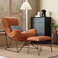 Modern Orange Lounge Chair with Ottoman Checkered Pillow Near Window Blinds Black Dresser and Potted Plant