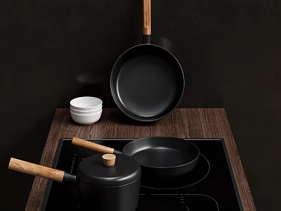 Cookware With Wooden Handles And Bowls On Induction Cooktop 3d model