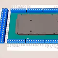 Industrial Circuit Board With Blue Terminal Blocks And Numbered Labels