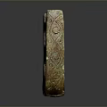 Ancient Style Carved Sculpture with Intricate Surface Patterns Two Circular Holes and Bronze Patina Finish