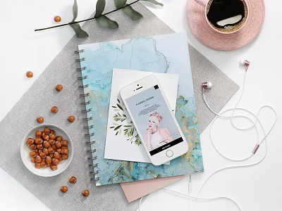 Artistic Notebook on Desk With Smartphone Earphones Hazelnuts Coffee Cup And Green Leaves 3d model