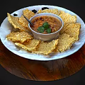 Crispy Chips Arranged Around Bowl Of Savory Dip With Fresh Coriander On Wooden Serving Tray
