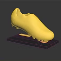 Golden Football Boot Displayed On Black Base With Shiny Reflective Surface 3d model