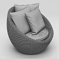 Round Wicker Leisure Chair With Beige Cushion And Colorful Floral Pattern Pillow