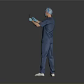 Man In Blue Medical Scrubs Holding X Ray With Gloves And Surgical Cap