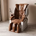 Brown Leather Massage Chair With Modern Ergonomic Design In Comfortable Home Setting With Plant