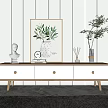Minimalist Modern White TV Stand With Wooden Drawers Legs Green Plant Artwork And Clock