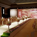 Elegant Banquet Hall Interior with Red Carpet Flower Arrangements and Decorative Backdrop