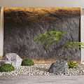 Garden Decorative Arrangement With Stone Wall Pebble Ground Stones Green Shrubs And Fern Plant