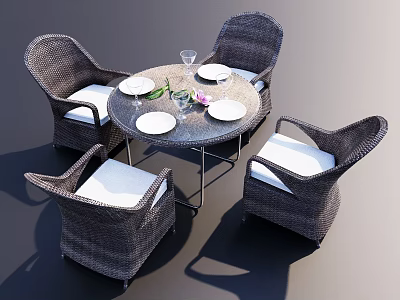Wicker Table And Chair Set With Round Table Four Chairs White Cushions And Dinnerware 3d model
