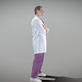 Man in White Lab Coat and Purple Pants Standing with Arms Crossed Against Gray Background
