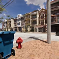 Row of Terraced Townhouses with Colorful Facades Balconies and Urban Street View
