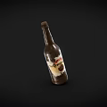 Brown Glass Beer Bottle With Label Isolated On Black Background