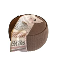 Round Brown Textured Ottoman With Decorative Patterned Fabric Draped On Top 3d model
