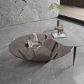 Modern Round Glass Coffee Table With Black Frame Tray Green Plant On Gray Marble Floor